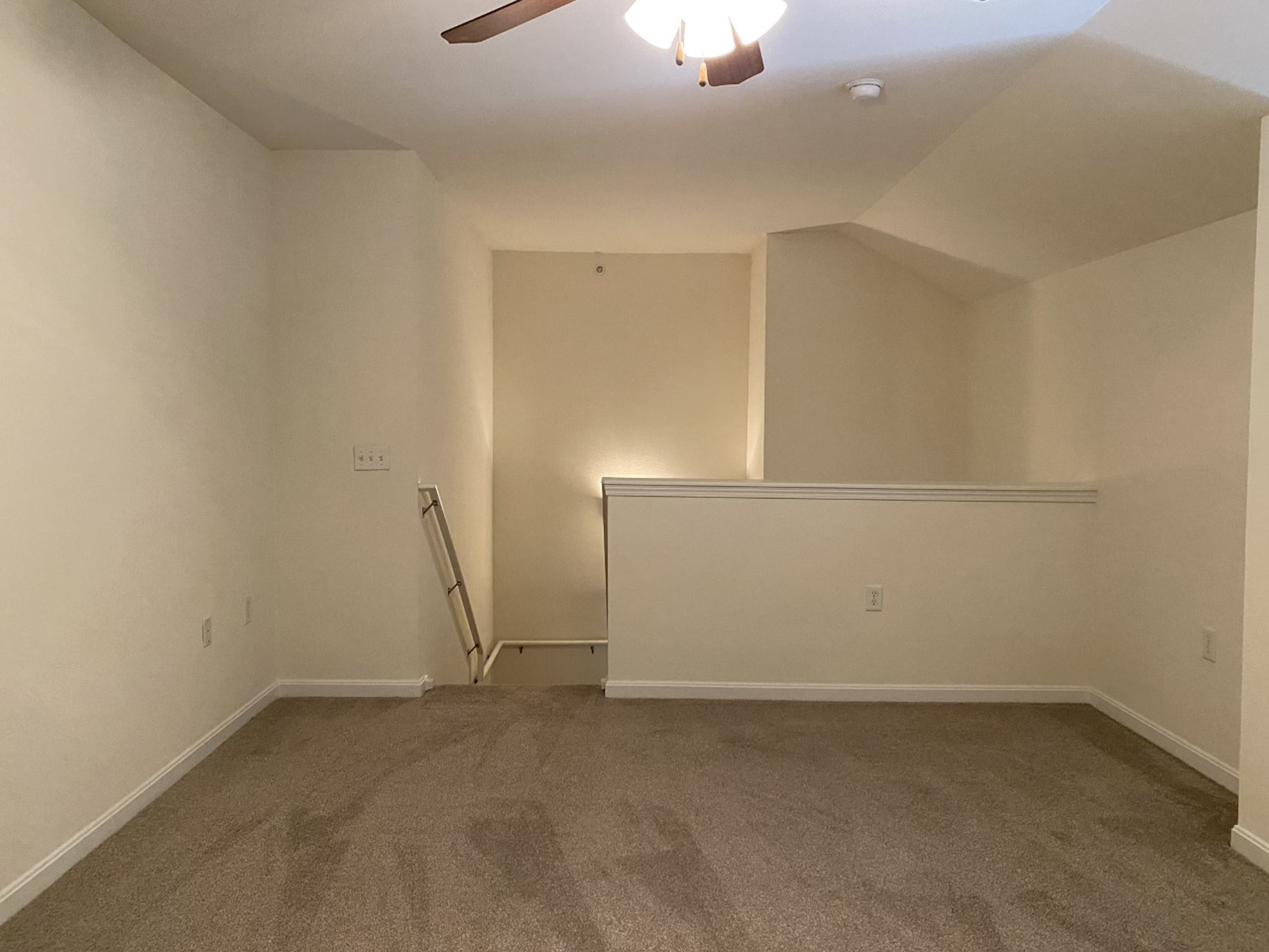 Carpeted floors and ceiling fan